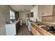 Functional kitchen with tile flooring and essential appliances at 2125 Flower Ave, North Las Vegas, NV 89030