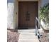 The front entrance has stately brown double doors and a secure handrail at 2569 Malabar Ave, Las Vegas, NV 89121