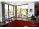 Bright kitchen with garden window offering outdoor views, ample counter space, and storage at 2569 Malabar Ave, Las Vegas, NV 89121