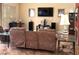 Living room featuring recliner seating, entertainment center, and hardwood flooring at 2569 Malabar Ave, Las Vegas, NV 89121