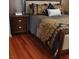 Beautifully designed primary bedroom with dark wood floors, and custom designed accents at 2569 Malabar Ave, Las Vegas, NV 89121