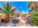 The backyard features mature landscaping, hardscape, and seating areas at 2853 Blythswood Sq, Henderson, NV 89044