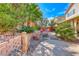 The backyard features mature landscaping, hardscape, and a firepit area at 2853 Blythswood Sq, Henderson, NV 89044