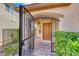 Close up of a gated front entrance, brick paved walkway, and well manicured landscaping at 2853 Blythswood Sq, Henderson, NV 89044
