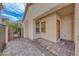 View of the front entrance of the home featuring an arched front porch and brick paved entrance at 2853 Blythswood Sq, Henderson, NV 89044