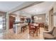 Open-concept kitchen and dining area with a large island, modern appliances, and hardwood floors at 2853 Blythswood Sq, Henderson, NV 89044