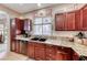Modern kitchen featuring granite countertops, stainless steel appliances, and ample cabinet space at 2853 Blythswood Sq, Henderson, NV 89044