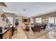 Comfortable and modern living room with hardwood floors, a ceiling fan, and an area rug at 2853 Blythswood Sq, Henderson, NV 89044