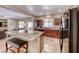 Spacious living area with an island kitchen, connecting seamlessly to the dining and living areas at 2853 Blythswood Sq, Henderson, NV 89044