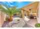The covered patio features ceiling fans, a grill, and well-maintained landscaping at 2853 Blythswood Sq, Henderson, NV 89044