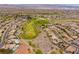 This is an aerial shot of homes surrounding a lovely golf course at 3017 Walnut Park Ct, Henderson, NV 89052