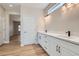 Bright bathroom featuring dual sinks and modern lighting fixtures at 3017 Walnut Park Ct, Henderson, NV 89052