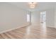 Spacious bedroom features wood-look floors and modern light fixture at 3017 Walnut Park Ct, Henderson, NV 89052