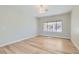 An airy bedroom with wood-look floors and a view to the backyard at 3017 Walnut Park Ct, Henderson, NV 89052
