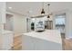 Spacious kitchen with a large island, white cabinets, stainless steel appliances, and modern fixtures at 3017 Walnut Park Ct, Henderson, NV 89052