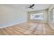 Expansive living room with natural lighting, neutral paint, and modern wood-look flooring at 3017 Walnut Park Ct, Henderson, NV 89052