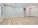 Bright, open living room showcasing wood-look flooring, neutral walls, and ample natural light at 3017 Walnut Park Ct, Henderson, NV 89052