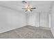 Bedroom featuring a ceiling fan and a closet, with carpeted flooring at 309 Gemstone Hill Ave, North Las Vegas, NV 89031