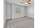 Bedroom featuring a ceiling fan and a window, with carpeted flooring at 309 Gemstone Hill Ave, North Las Vegas, NV 89031