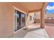 Covered patio with a sliding glass door, offering a seamless transition from indoor to outdoor living spaces at 309 Gemstone Hill Ave, North Las Vegas, NV 89031