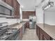 Close-up of kitchen featuring stainless appliances, granite countertops, and a center island at 309 Gemstone Hill Ave, North Las Vegas, NV 89031