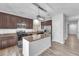 Modern kitchen featuring granite counters, stainless appliances, and a center island at 309 Gemstone Hill Ave, North Las Vegas, NV 89031