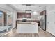 Stylish kitchen featuring granite counters, stainless appliances, and wood-look floors at 309 Gemstone Hill Ave, North Las Vegas, NV 89031