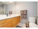 Bathroom with single sink vanity, updated mirror, and tile flooring at 3360 Cheltenham St, Las Vegas, NV 89129