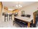 Dining area adjacent to the kitchen and features a stylish chandelier at 3360 Cheltenham St, Las Vegas, NV 89129