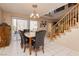 Bright dining area with access to the backyard and an adjacent staircase at 3360 Cheltenham St, Las Vegas, NV 89129