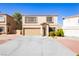 Inviting two-story home featuring a two-car garage and manicured landscaping at 3360 Cheltenham St, Las Vegas, NV 89129