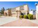Charming two-story home with manicured landscaping, garage, and appealing architectural details at 3360 Cheltenham St, Las Vegas, NV 89129