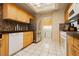 Functional kitchen with tiled floors and stainless steel appliances at 3360 Cheltenham St, Las Vegas, NV 89129