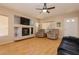 Cozy living room featuring a fireplace, ceiling fan, and neutral walls at 3360 Cheltenham St, Las Vegas, NV 89129