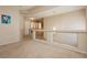 Open loft area with carpeted floors, half wall, and staircase in the background at 3360 Cheltenham St, Las Vegas, NV 89129