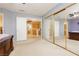 Open main bedroom with carpeted floors and mirrored closet doors at 3360 Cheltenham St, Las Vegas, NV 89129