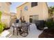 Patio area featuring outdoor dining set, grill, and views of the surrounding neighborhood at 3360 Cheltenham St, Las Vegas, NV 89129