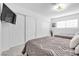 Comfortable bedroom featuring neutral carpet, bed, and ample closet space at 3611 Valencia St, Las Vegas, NV 89121