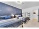 Cozy bedroom featuring two beds, star accent wall, and ample space at 3611 Valencia St, Las Vegas, NV 89121