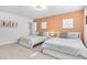 Bright bedroom featuring two beds, and warm earth tone decor at 3611 Valencia St, Las Vegas, NV 89121