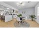 Bright dining area with modern lighting and a view into the stylish kitchen at 3611 Valencia St, Las Vegas, NV 89121