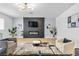 Cozy living room with a modern fireplace, sleek furniture, and ample natural light at 3611 Valencia St, Las Vegas, NV 89121