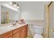 Bright bathroom features a white countertop, wooden cabinets, and marble tile accents at 3692 Rawhide Ct, Las Vegas, NV 89120