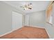 Bedroom with ceiling fan, carpet flooring, and closet with sliding doors at 3692 Rawhide Ct, Las Vegas, NV 89120