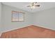 Bedroom with ceiling fan, carpet flooring, and window with blinds at 3692 Rawhide Ct, Las Vegas, NV 89120