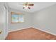 Bedroom with ceiling fan, carpet flooring, and window with blinds at 3692 Rawhide Ct, Las Vegas, NV 89120