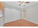 Bedroom with ceiling fan, carpet flooring, and closet with sliding doors at 3692 Rawhide Ct, Las Vegas, NV 89120
