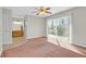 Bedroom featuring carpet flooring and sliding glass door for natural light and access to the outdoors at 3692 Rawhide Ct, Las Vegas, NV 89120