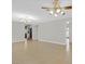 Open living room with tile flooring and a ceiling fan, perfect for relaxing or entertaining at 3692 Rawhide Ct, Las Vegas, NV 89120
