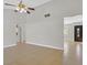 Open living room with tile flooring and views into other rooms and the front door at 3692 Rawhide Ct, Las Vegas, NV 89120